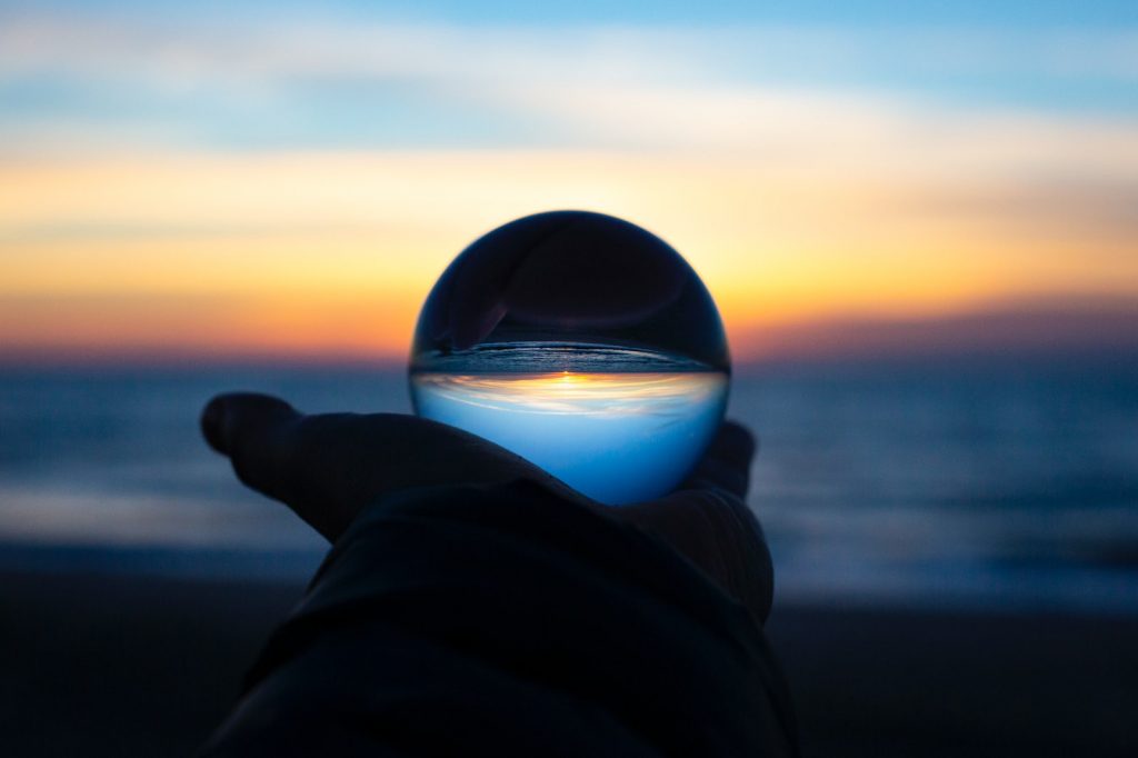 person holding clear glass glass